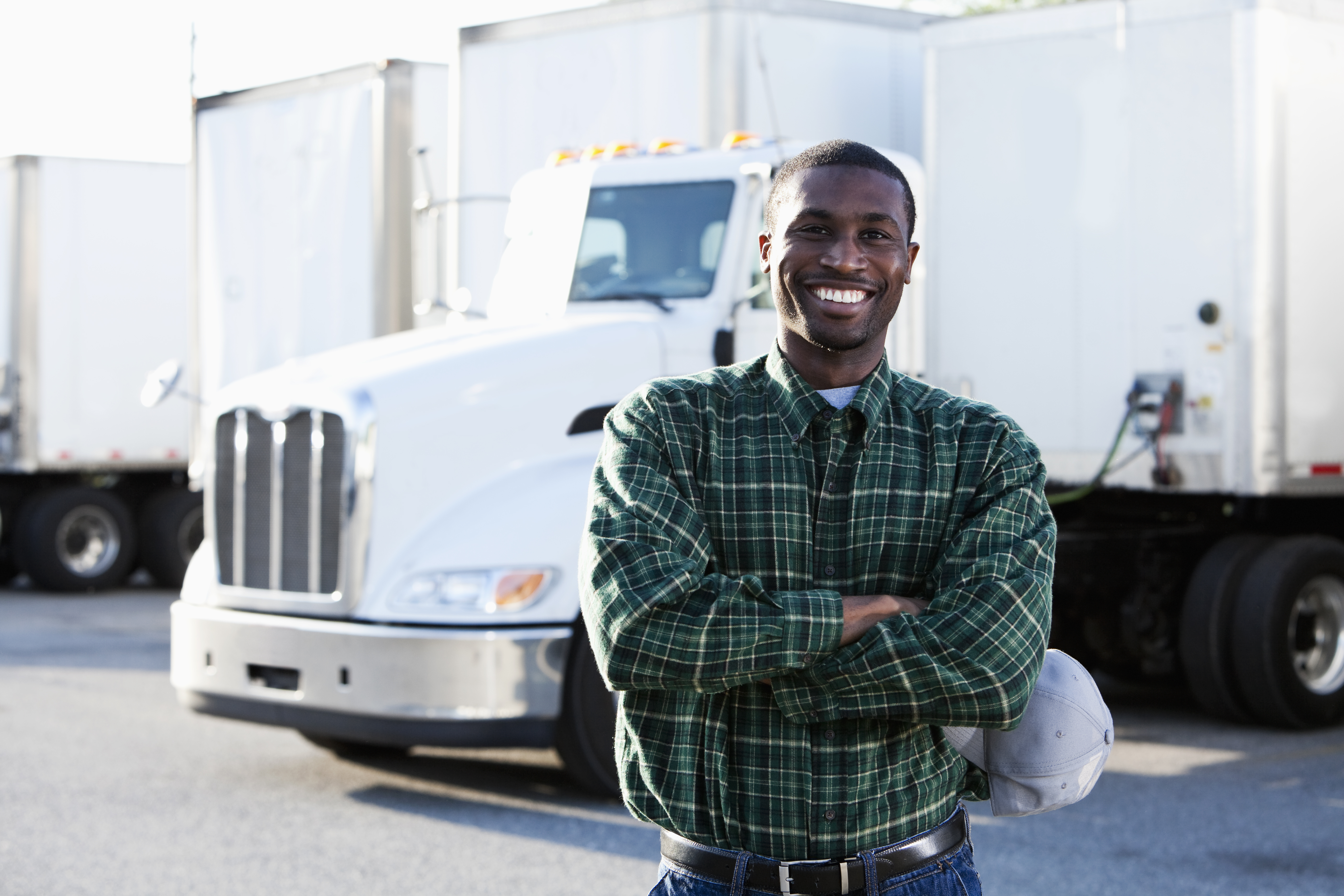 Man standing in front of his semi-truck