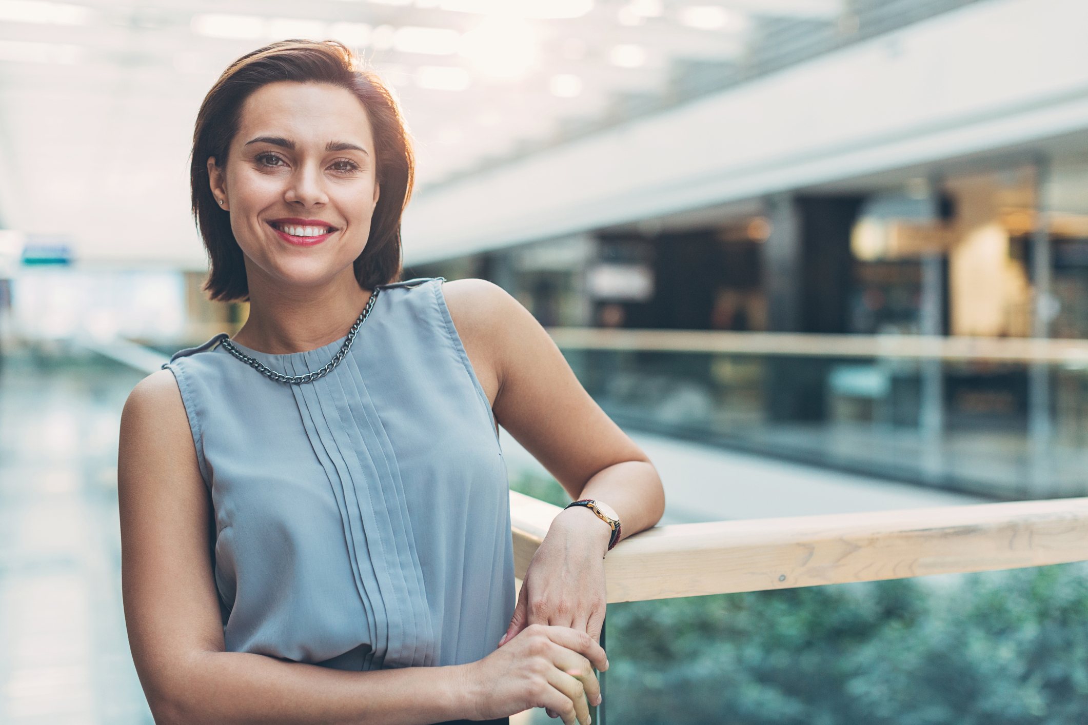 Elegant businesswoman standing in business environment